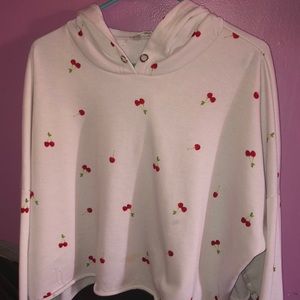 It has 2 black stripes on the sleeves and cherrys